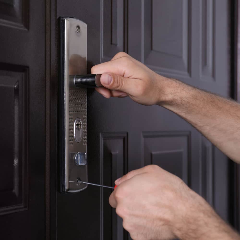 Locksmith changing a lock